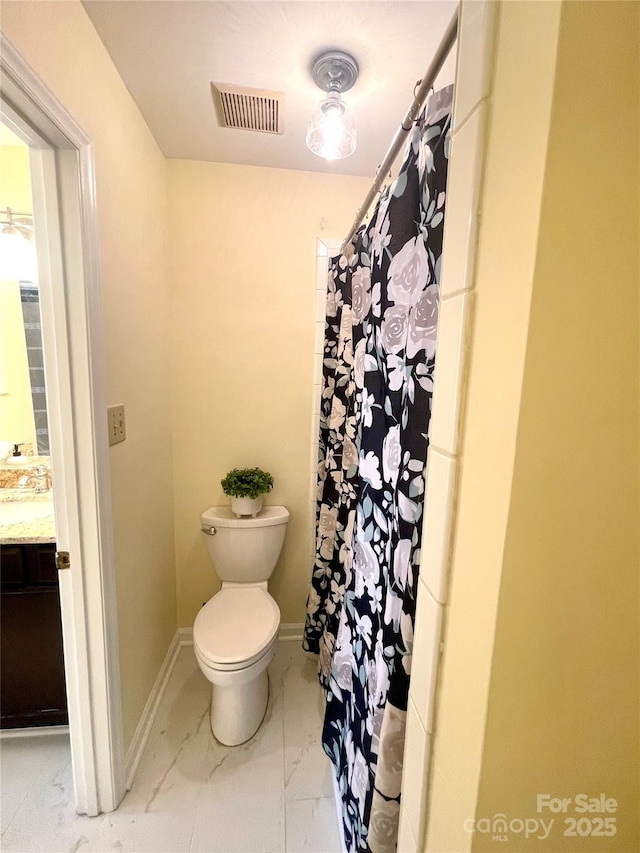 bathroom featuring toilet, marble finish floor, visible vents, curtained shower, and vanity