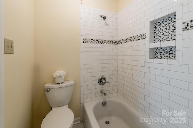 bathroom featuring toilet and  shower combination