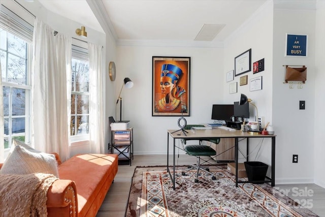 office area featuring crown molding, baseboards, and wood finished floors