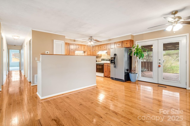 kitchen with stainless steel fridge, french doors, under cabinet range hood, electric range oven, and ceiling fan