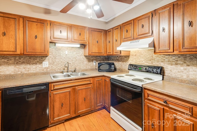 kitchen with white electric range, black dishwasher, under cabinet range hood, a sink, and brown cabinetry