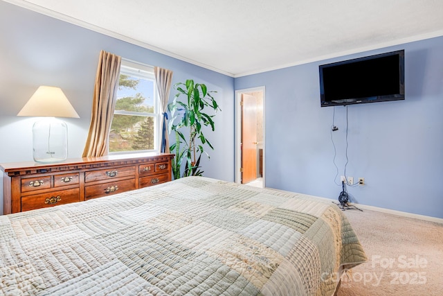 carpeted bedroom featuring baseboards
