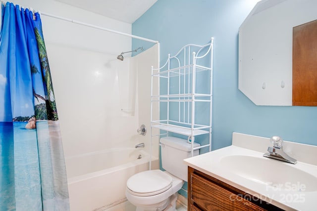 full bath featuring toilet, vanity, and shower / tub combination