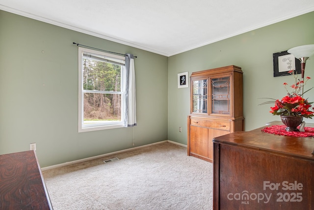 unfurnished office featuring light carpet, baseboards, and visible vents