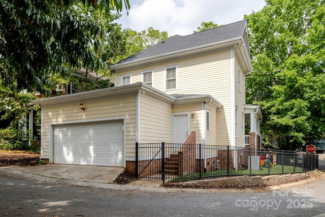 734 E 10th St, Charlotte, NC 28202 - traditional-style home with concrete driveway, a garage, and fence private yard