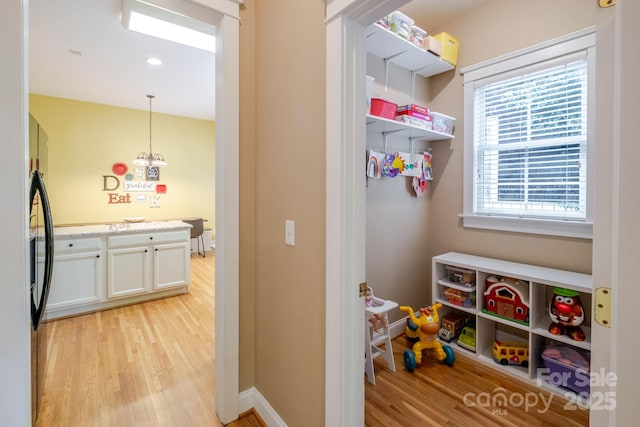 734 E 10th St, Charlotte, NC 28202 - playroom featuring baseboards and light wood-type flooring