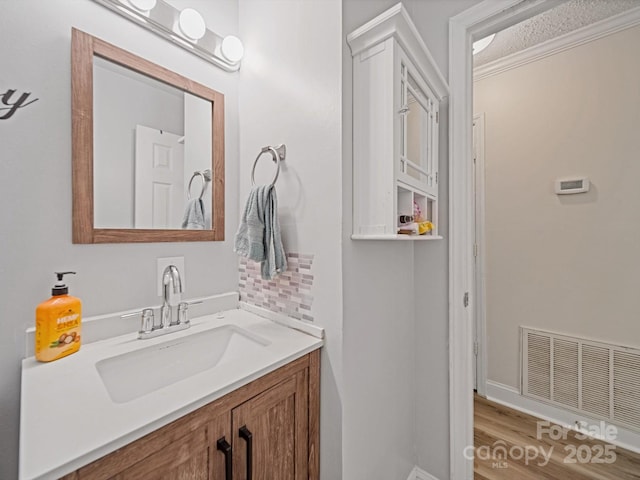 bathroom featuring vanity and wood finished floors