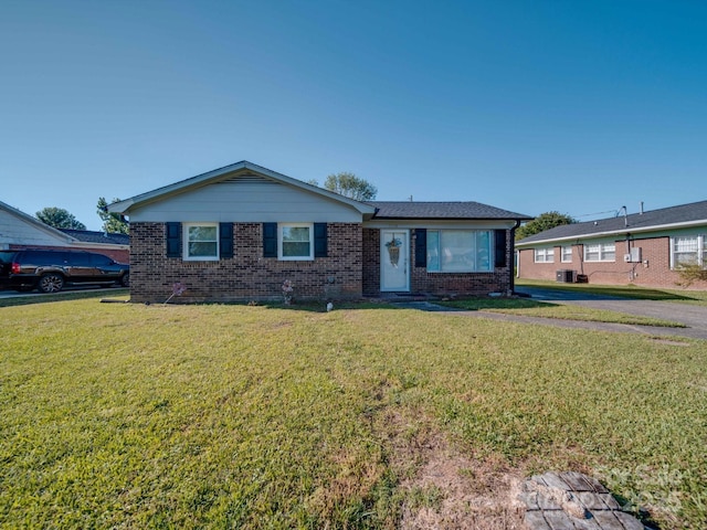 ranch-style house with brick siding and a front lawn