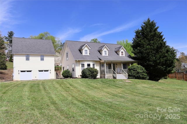 cape cod-style house featuring covered porch, a garage, and a front yard