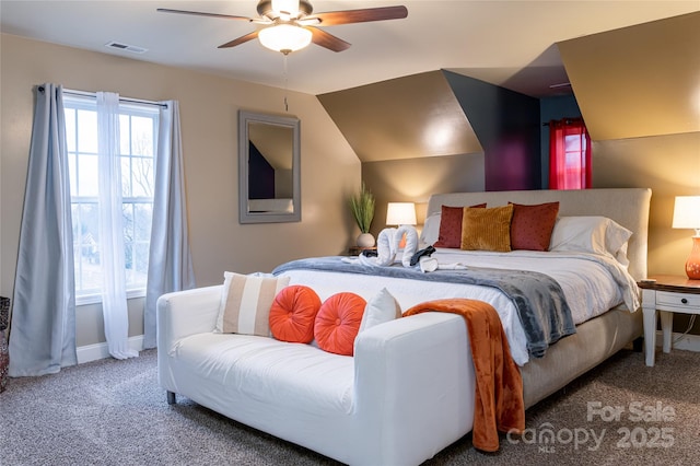 carpeted bedroom featuring ceiling fan and vaulted ceiling