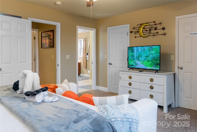 bedroom with light colored carpet and ensuite bathroom