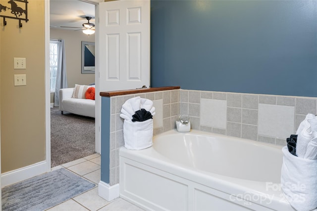 bathroom featuring tile patterned floors, a bath, ensuite bath, and ceiling fan
