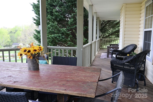 deck featuring outdoor dining space
