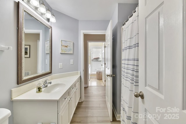 7844 Village Harbor Dr, Cornelius, NC 28031 - full bathroom featuring toilet, vanity, and baseboards