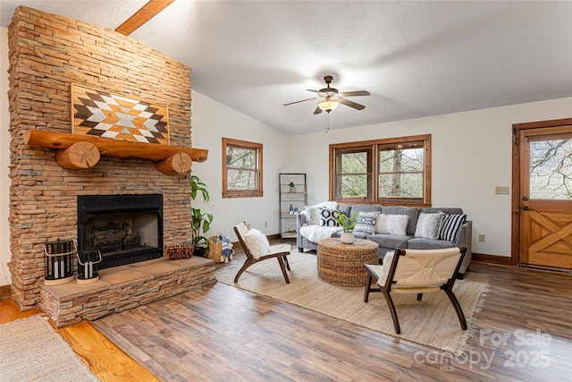 39 Antler Springs Way, Maggie Valley, NC 28751 - living area featuring vaulted ceiling, wood finished floors, baseboards, a ceiling fan, and a textured ceiling