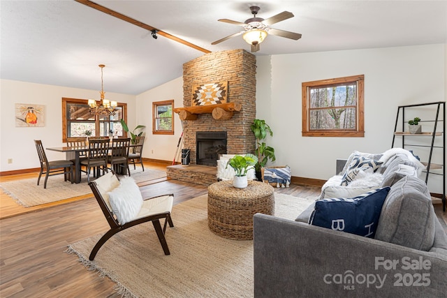39 Antler Springs Way, Maggie Valley, NC 28751 - living area with vaulted ceiling, wood finished floors, baseboards, a ceiling fan, and a chandelier