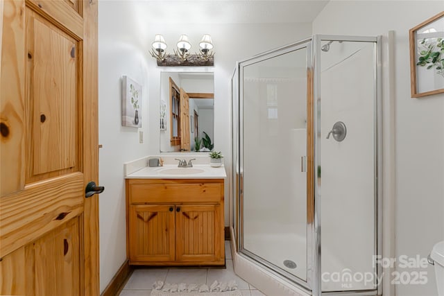39 Antler Springs Way, Maggie Valley, NC 28751 - bathroom featuring vanity, a shower stall, tile patterned floors, and toilet