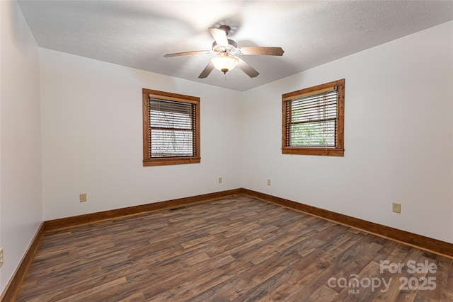 39 Antler Springs Way, Maggie Valley, NC 28751 - spare room featuring dark wood finished floors, ceiling fan, baseboards, and a textured ceiling