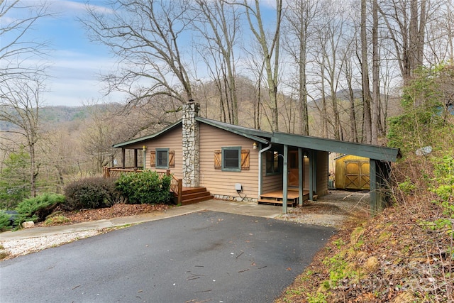 39 Antler Springs Way, Maggie Valley, NC 28751 - view of front of home with asphalt driveway and a chimney