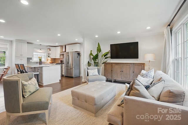 living area with recessed lighting and dark wood-type flooring