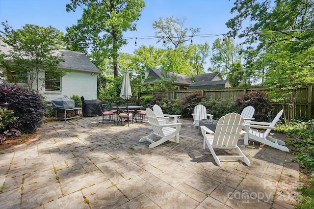 5400 Glenham Dr, Charlotte, NC 28210 - fenced backyard with a patio area, grilling area, and outdoor dining space
