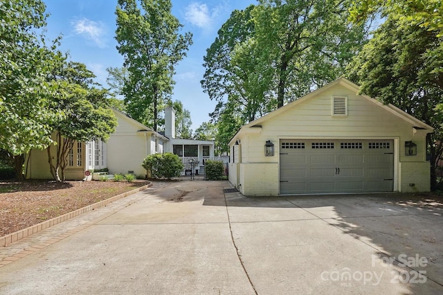 5400 Glenham Dr, Charlotte, NC 28210 - view of front of home featuring brick siding, an outdoor structure, and concrete driveway