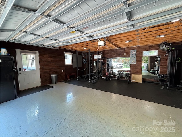 5400 Glenham Dr, Charlotte, NC 28210 - garage with wood walls and a garage door opener
