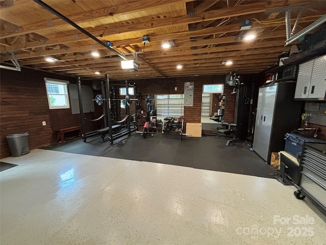 5400 Glenham Dr, Charlotte, NC 28210 - basement featuring a garage and wood walls