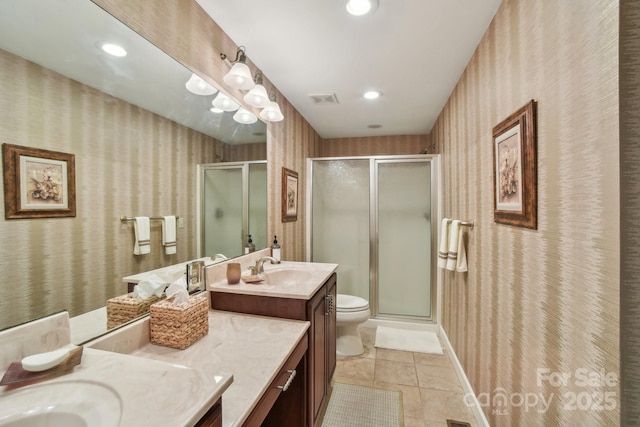 bathroom featuring wallpapered walls, visible vents, a shower stall, and tile patterned floors