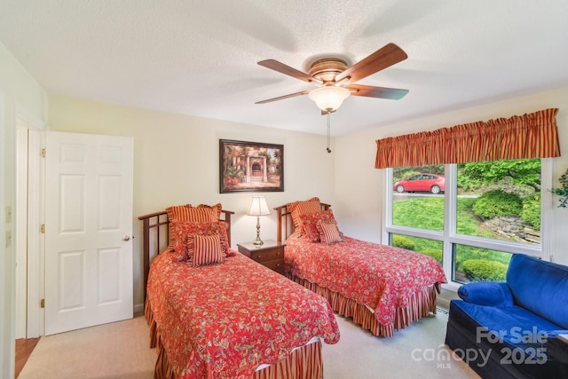 carpeted bedroom with a ceiling fan