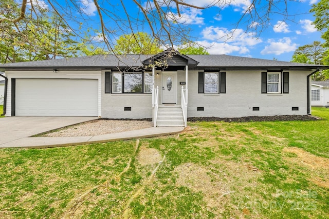 ranch-style house featuring crawl space, a front yard, an attached garage, a shingled roof, and concrete driveway