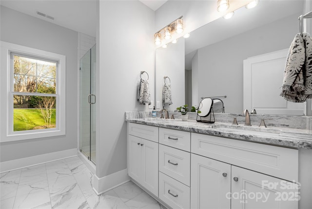 9849 Rich Hatchet Rd, Huntersville, NC 28078 - bathroom with a shower stall, marble finish floor, baseboards, visible vents, and double vanity
