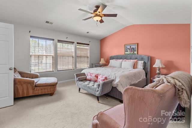 bedroom featuring visible vents, carpet, baseboards, ceiling fan, and vaulted ceiling