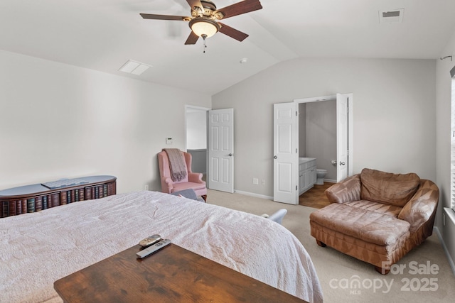 bedroom with ceiling fan, visible vents, vaulted ceiling, and light carpet