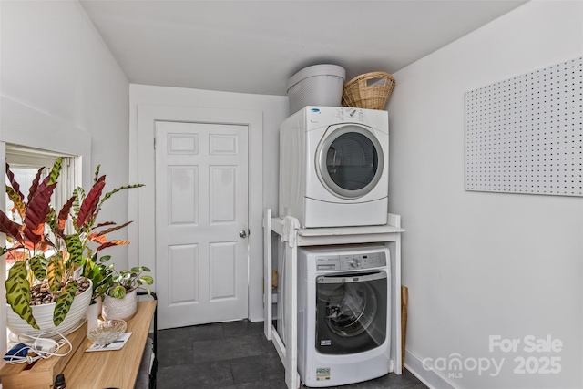 21 Hilldale Rd, Asheville, NC 28803 - laundry area featuring stacked washer / drying machine