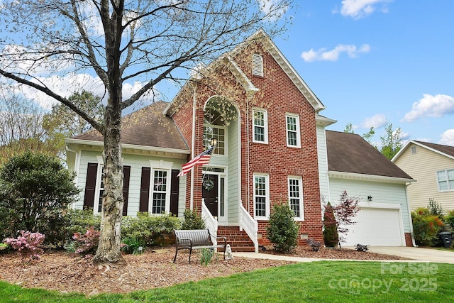 1214 Foxfield Rd, Waxhaw, NC 28173 - traditional-style house featuring an attached garage, driveway, brick siding, a front yard, and a shingled roof