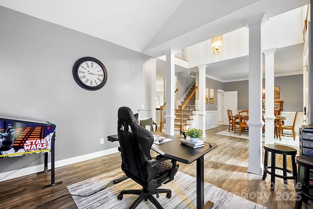 1214 Foxfield Rd, Waxhaw, NC 28173 - office featuring decorative columns, wood finished floors, vaulted ceiling, ornamental molding, and wainscoting