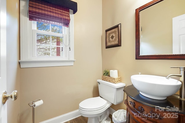 1214 Foxfield Rd, Waxhaw, NC 28173 - half bathroom featuring toilet, vanity, and baseboards