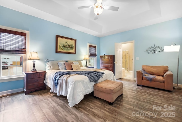 1214 Foxfield Rd, Waxhaw, NC 28173 - bedroom featuring wood finished floors, baseboards, a tray ceiling, and ceiling fan