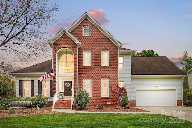 1214 Foxfield Rd, Waxhaw, NC 28173 - view of front of house with an attached garage, driveway, a lawn, and brick siding