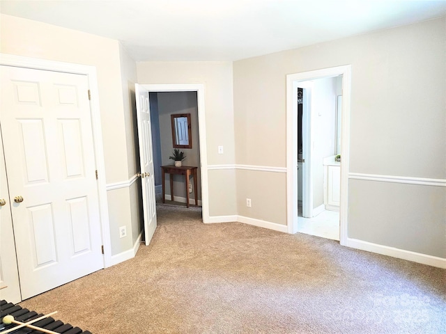 1214 Foxfield Rd, Waxhaw, NC 28173 - unfurnished bedroom featuring light carpet and ensuite bathroom