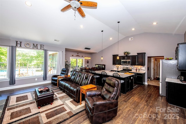 living area featuring vaulted ceiling, dark wood-style floors, and visible vents