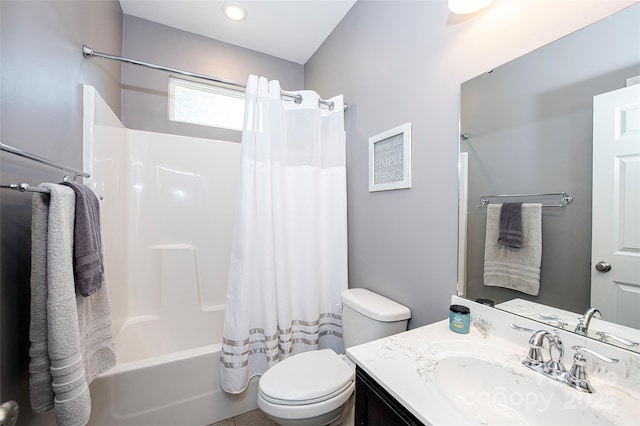 bathroom with vanity, toilet, and shower / tub combo