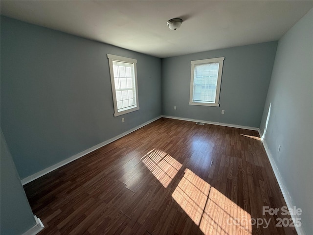 3316 Queens Ln Unit 10, Gastonia, NC 28052 - spare room with dark wood-style floors and baseboards