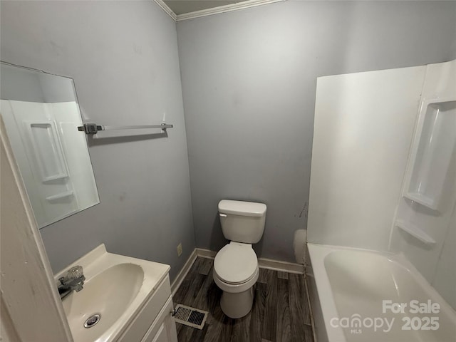 3316 Queens Ln Unit 10, Gastonia, NC 28052 - bathroom with vanity, toilet, baseboards, visible vents, and wood finished floors