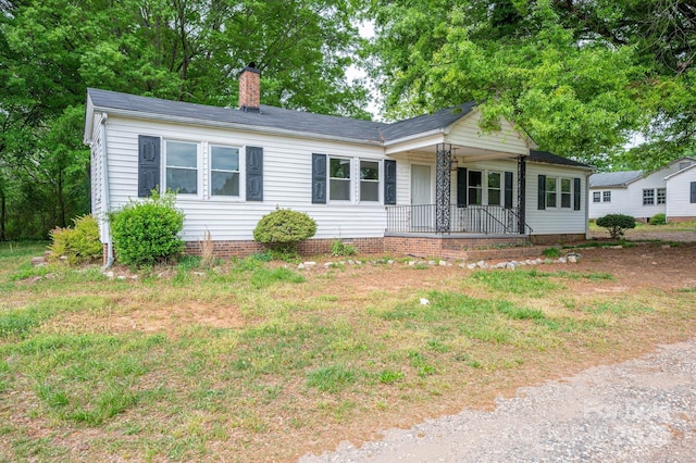 201 Lee Black Rd, Cherryville, NC 28021 - ranch-style house featuring a chimney and covered porch