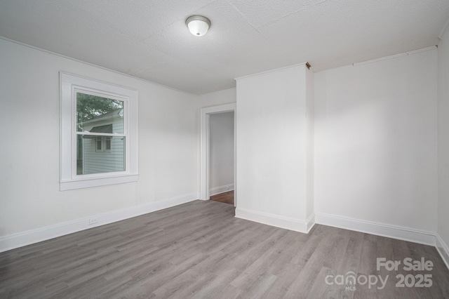 201 Lee Black Rd, Cherryville, NC 28021 - unfurnished room with baseboards, wood finished floors, and a textured ceiling
