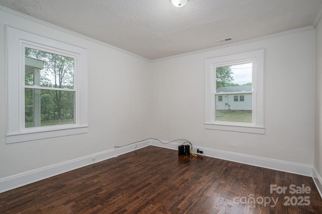201 Lee Black Rd, Cherryville, NC 28021 - spare room with dark wood-style flooring, a textured ceiling, baseboards, ornamental molding, and visible vents