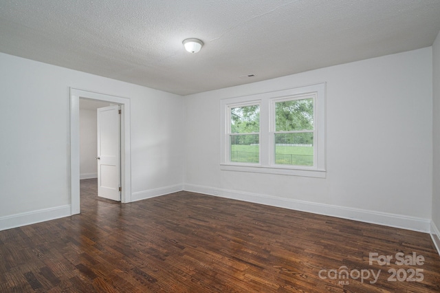 201 Lee Black Rd, Cherryville, NC 28021 - unfurnished room featuring baseboards, a textured ceiling, and dark wood finished floors