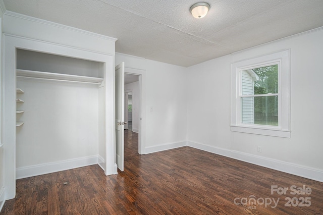 201 Lee Black Rd, Cherryville, NC 28021 - unfurnished bedroom with baseboards, wood finished floors, a textured ceiling, and a closet